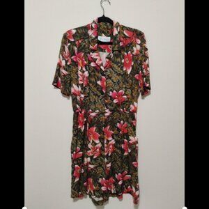 Vintage floral button-up romper with flowy shorts.
